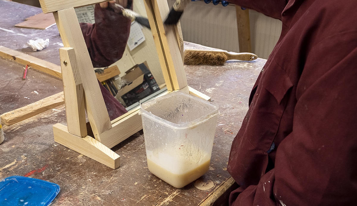 Student making a wooden mirror
